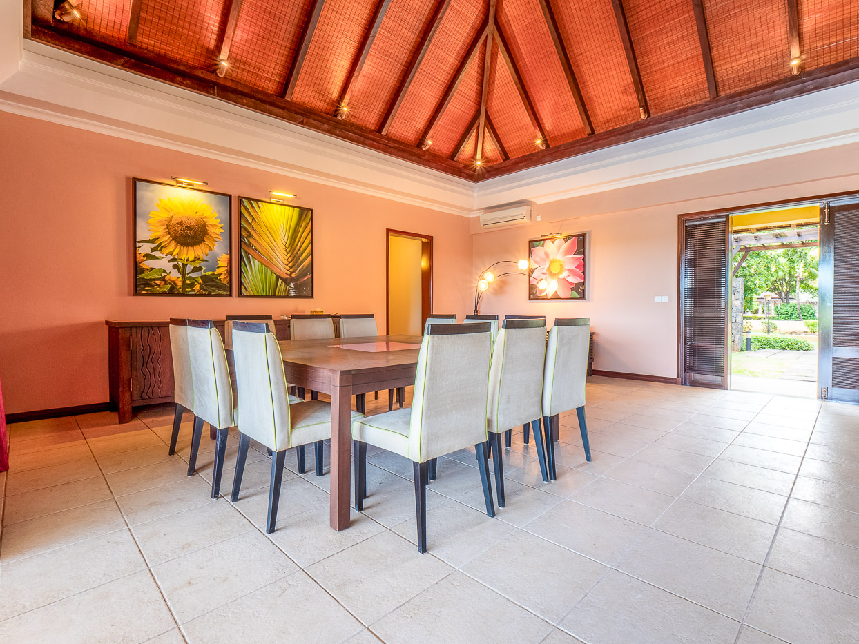 Bright living room with high ceilings in a Tamarina luxury villa by Ohana Heritage Group