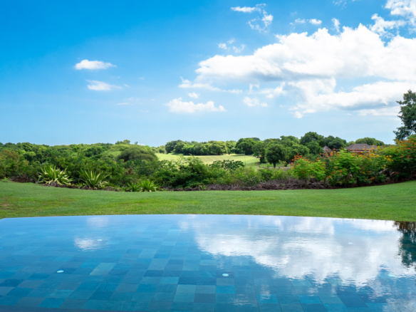 Lush garden and private pool with Tamarina golf view by Ohana Heritage Group